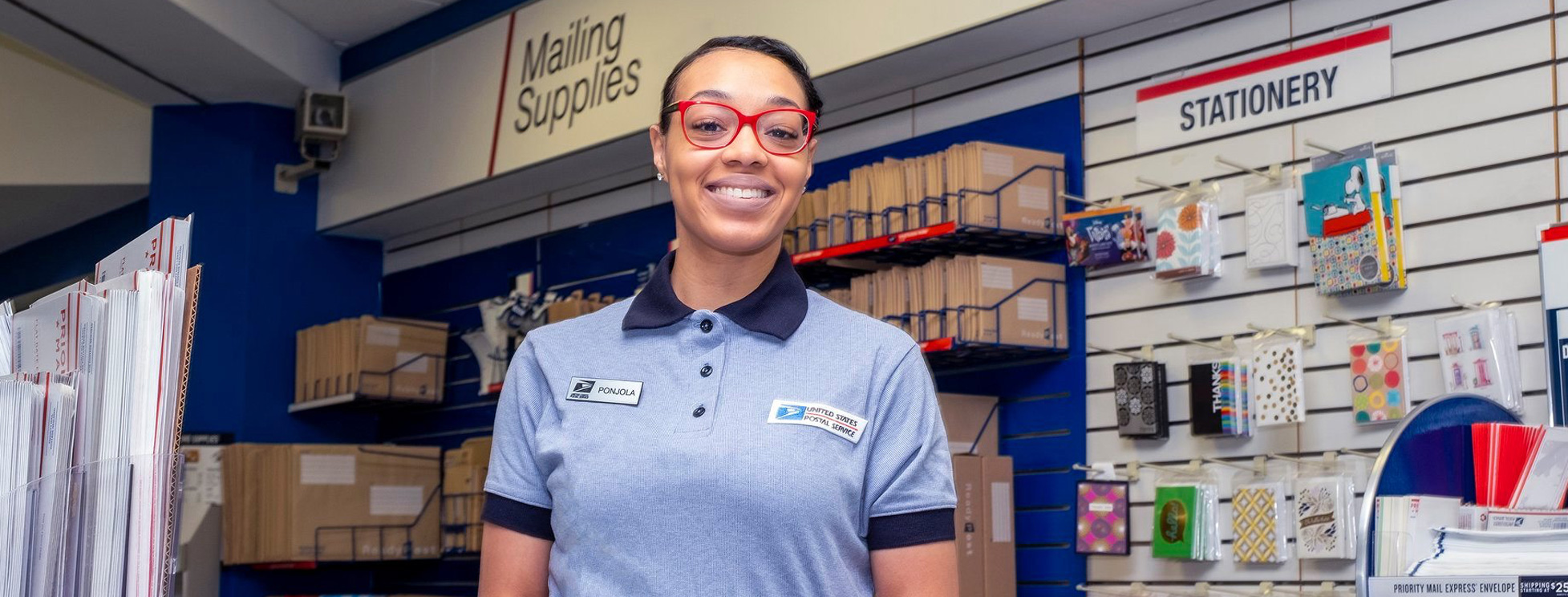 USPS postal woman working behind the counter at Grossmont Center in La Mesa