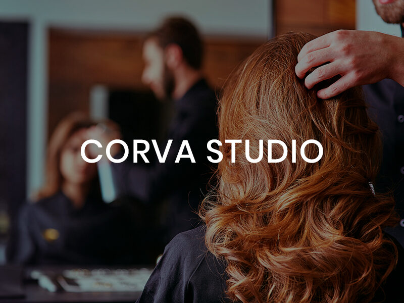 Corva Studio name over an image of a red headed woman at a hair salon.
